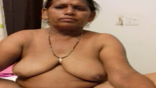 An Indian mature woman gets naked in front of her man